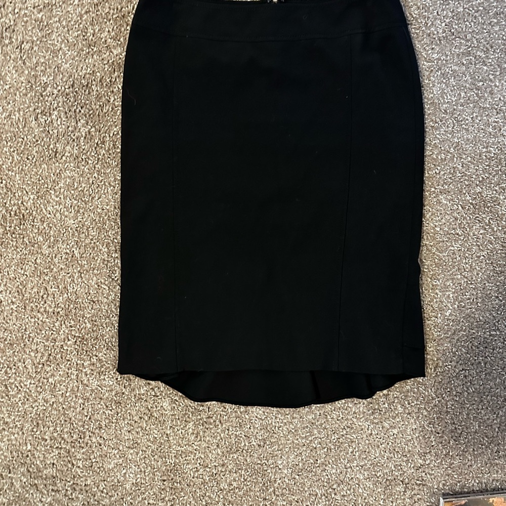 Black pencil skirt with Peplum hem in the back from express design studio.